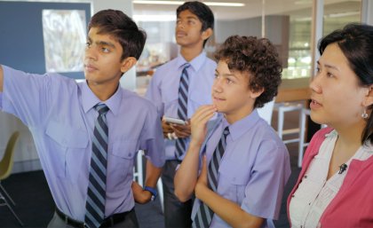Brisbane Grammar School students with Head of Physics Noël Chan discuss the outcomes of their experiment on acceleration due to gravity. Brisbane Grammar School students with Head of Physics Noël Chan discuss the outcomes of their experiment on acceleration due to gravity.